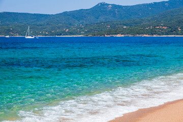 Sandy beach scene on sunny summer day. Propriano, Corsica, France