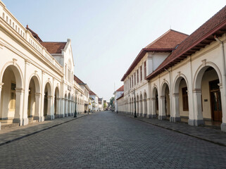 Fototapeta premium Street architecture of Yogyakarta with classic buildings, empty street, clean composition, daylight.
