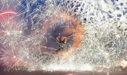 A blurry image of a circus act with fire