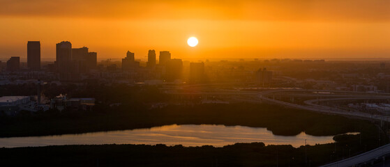 View from above of contemporary high skyscraper buildings in downtown district of Tampa city in Florida, USA at sunset. American megapolis with business financial district