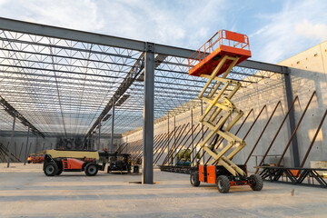 Warehouse construction. Concrete and metal structure of industrial building. Frame of modern logistic center