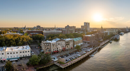 Waterfront River Street in Savannah, Georgia. Historic American architecture of old historical city. USA Southern cityscape at sunset