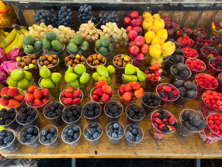 Assorted Fresh Berries and Exotic Fruits in Plastic Cups