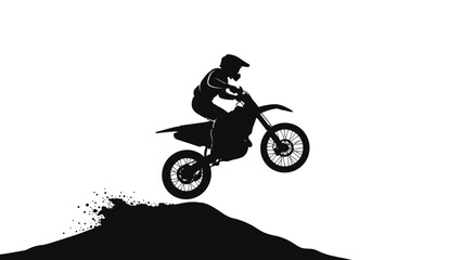 Silhouette of a motocross rider performing a jump on a dirt bike © Ashik