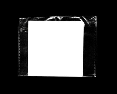 Plastic transparent frame-style pouch, reflective sleeve with white sticker used for labeling, packaging and protective document storage.