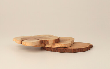 Wooden eco rustic pine tree wood circle disc platform podium on light beige background. Minimal empty display product presentation scene.