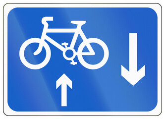 Regulatory road sign used in Ireland - Oncoming bicycles on the left