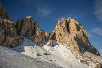 Beautiful Rocky Peaks with Snow Covered Nature in Dolomites. Winter Scenery of Rock Formation during Sunny Day in Northeastern Italy.