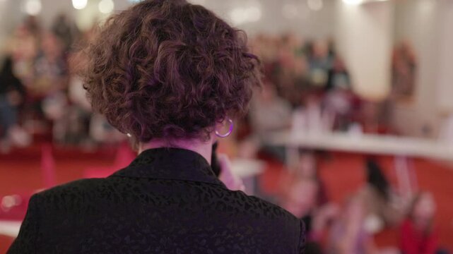 Female speaker presenting at business conference