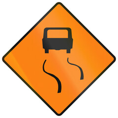 Temporary warning road sign used in Ireland - Slippery surface