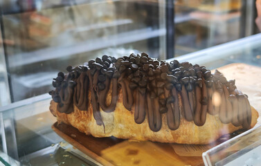 Croissant topped with chocolate cream.