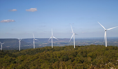 Wind farm on the mountain, blue sky and white clouds
