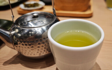 Hot matcha tea in a cup.