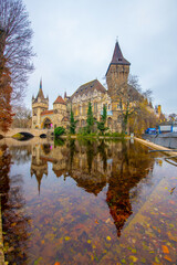 Fototapeta premium Vajdahunyad Castle with waterfront in Budapest at christmas time. Amazing Reflection.