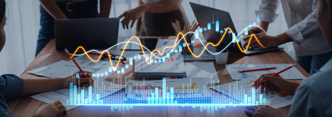 A dynamic business team engages in a collaborative session, analyzing digital analytics and strategies to drive growth and improve performance in a modern workspace. Scalp