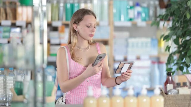 Young woman buyer scanning qr code for feminine sanitary pads in pharmacy