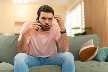 Angry man arguing on phone making gesture
