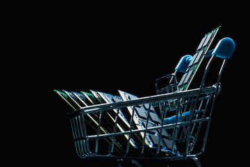 Close up of laptop ddr memory modules in shopping cart isolated on black background