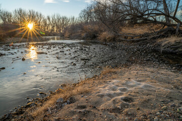 winter sunrise over Poudre RIver in Fort Collins, Colorado