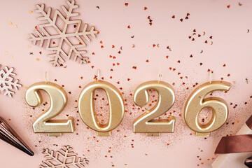 Close-Up of 2026 Gold Candles with Glitter and Snowflakes