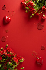 A vivid vertical red background features roses, heart charms, and sparkling accents, creating a...