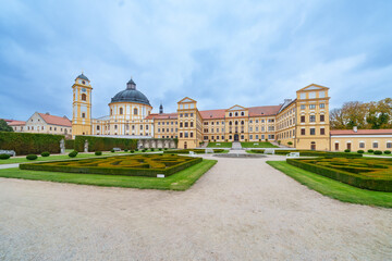 Obraz premium View of Jaroměřice nad Rokytnou Castle with Adjacent Park, Fountain, Benches, and Lightly Clouded August Sky, Czech republic, Moravia