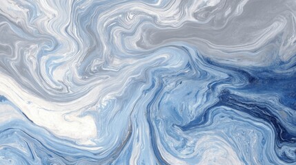Fototapeta premium The scene shows various shades of blue and gray paint blending together to form swirling patterns. The artwork displays fluid movement and texture typical of abstract designs in an artistic space.