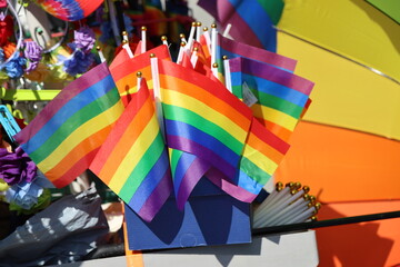Collection of small rainbow flags arranged together as colorful decoration