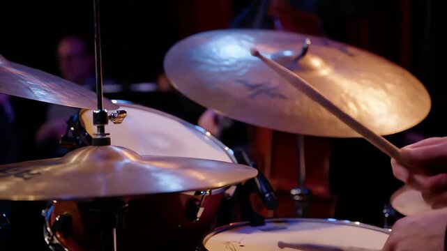 Close up dynamic shot of a musician playing drums on stage during a live jazz music performance