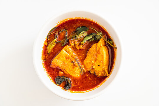 A vibrant, spicy Kerala-style Aavoli black pomfret fish curry, rich with traditional spices and fresh ingredients