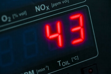 Digital display showing nitrogen oxide emissions level reading with O2 and RPM parameters visible