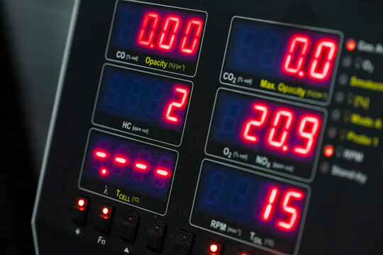 Multi display automotive emissions analyzer panel showing CO HC CO2 O2 NOx RPM and temperature readings simultaneously