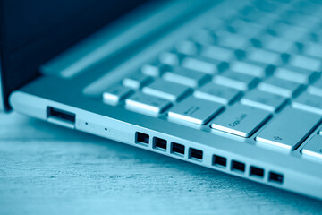 Close-up of gray keyboard and ports