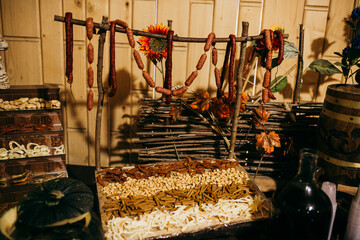 Hanging sausages and snacks at rustic food stall