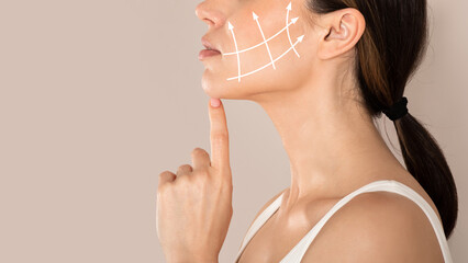 Cropped of young woman with clean fresh skin touching her chin, antiaging concept. Side view of...