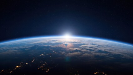 Obraz premium Distant view of planet Earth at sunrise from outer space, stars visible