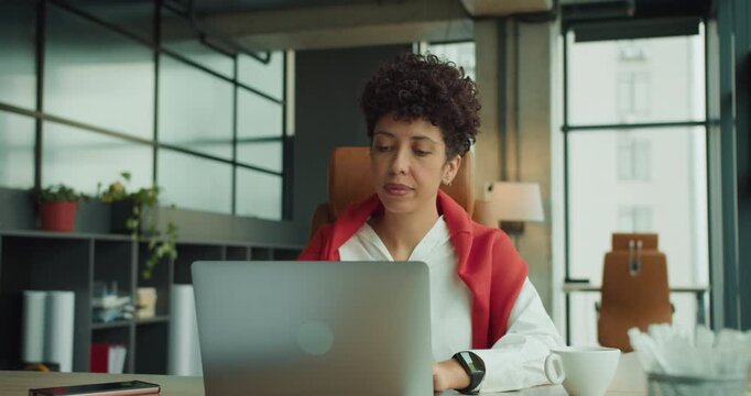 Focused professional analyzing financial documents carefully