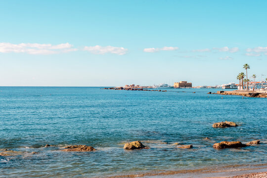 Picturesque view of the blue sea and the famous Paphos Castle on the horizon. Paphos, Cyprus