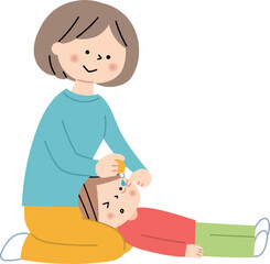 子供に目薬を指すお母さん
