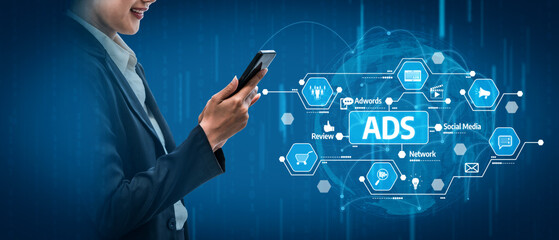 A sleek business professional uses a smartphone against a digital backdrop illustrating marketing concepts to showcase the importance of technology in advertising. Tessel