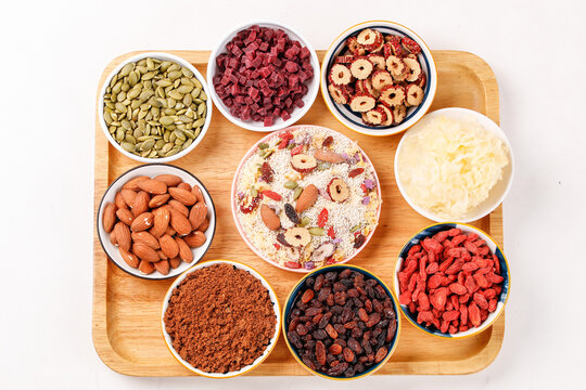 Dried Fruits, Nuts and Ingredients on Wooden Board