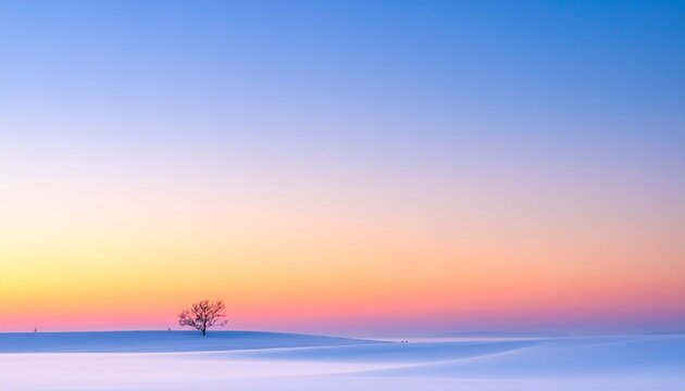 雪原に佇む木と朝焼けの空が広がる静かな希望背景