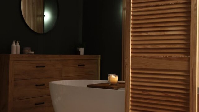 Tub, wooden folding screen and vanity in bathroom, camera moving in. Interior design