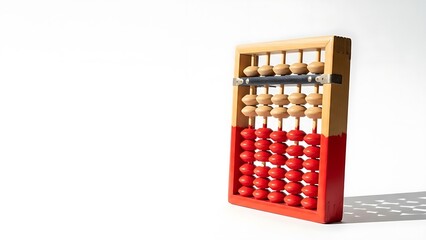 Vintage wooden abacus with red beads on a white background, casting a shadow