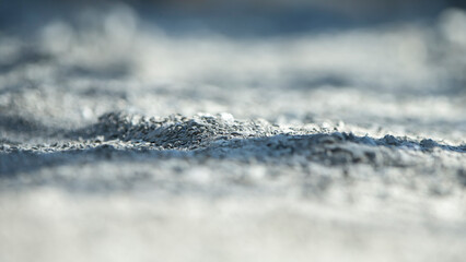 Close up of sand on construction site. Small depth of field.
