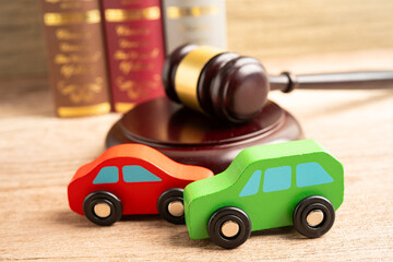 Hammer gavel judge with car vehicle accident, insurance coverage claim lawsuit court case.