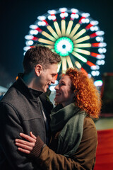 Couple embracing love and happiness at night carnival