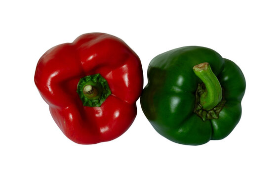 whole red and green bell peppers isolated