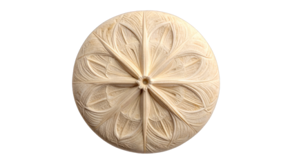 Round, ivory-toned carving with a symmetrical floral design on a black backdrop