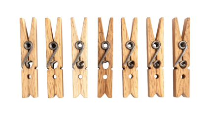 Seven wooden clothespins in a row, with metal springs, set against a black backdrop
